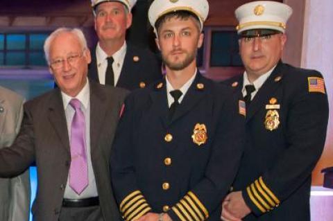 Elbert T. Edwards, far left, at an East Hampton Fire Department dinner in April, died last Thursday.