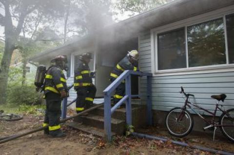 East Hampton firefighters battled heavy smoke conditions at a house on Morris Park Lane in East Hampton on Thursday morning.