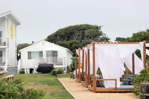 The owners of the new Hero Beach Club motel in Montauk recently added daybeds and other features to an outdoor lounge on the property. A new town law will make it impossible for guests to order food and drinks.