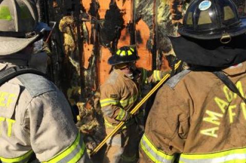 Firefighters surveyed the damage after a fire broke out at Lazy Point Thursday morning.