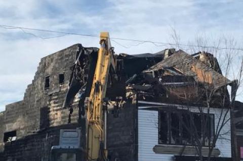 Keith Grimes Inc. worked to demolish the building at 84 Main Street in Sag Harbor, three days after a fire gutted it and undermined its structural integrity.