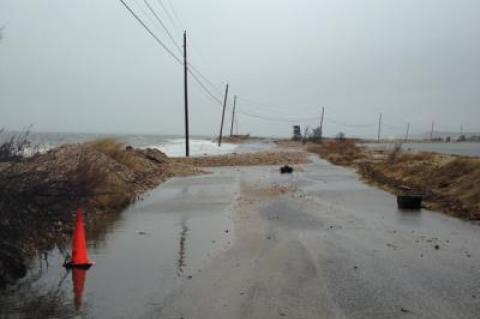 Waves from Gardiner's Bay during a storm in January overwashed a narrow section of Gerard Drive, causing officials to close the road. Consultants hired by East Hampton Town to develop a coastal assessment resiliency plan say the town's bayfront is more susceptible to impacts from storm surge and sea level than the oceanfront.