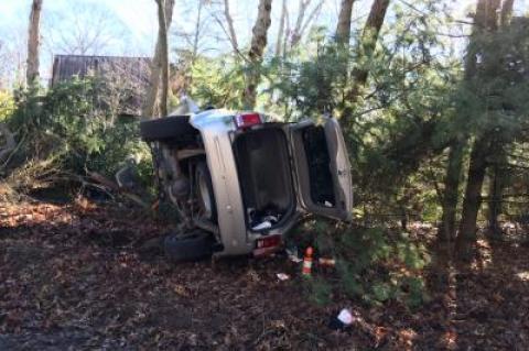 A Jeep Grand Cherokee rolled over onto its side after crashing into the woods on Wednesday morning.