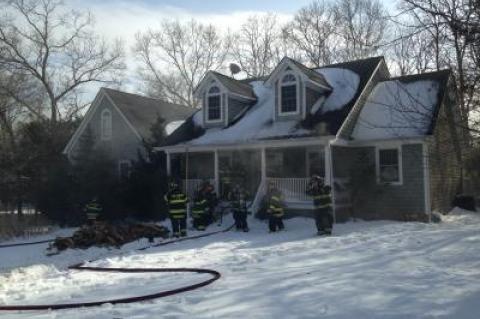 Firefighters got ready to enter a house on fire on Sea Farm Court in Bridgehampton Friday afternoon.