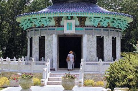 Although the replica of a Beijing temple looms over the garden, it is much smaller than the one it was modeled on.