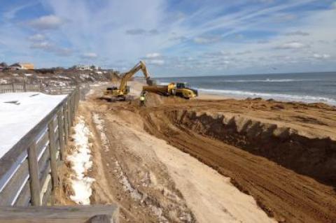 An Army Corps contractor building a sandbag seawall along the downtown Montauk ocean shoreline has reached the eastern end of the project's area.