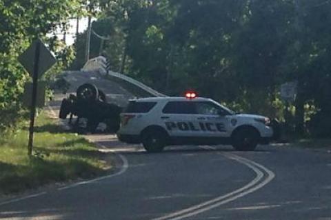 Police blocked Cranberry Hole Road after a Jeep rolled onto its roof, seriously injuring its driver.