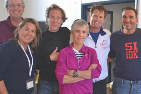 Mary Ellen Adipietro, left, and her husband, Frank Adipietro, at right, posed before last year’s Shelter Island 10K, which she directs, with Cliff Clark, one of the race’s founders, and Bill Rodgers, Joan Benoit Samuelson, and John Sinclair, three American marathon greats.