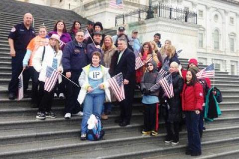 Representative Peter King, center, with a group of Long Island residents and people involved with the post-Sandy restoration effort who traveled to Washington on Tuesday for the House of Representative's vote on a $50.7 billion hurricane relief package.