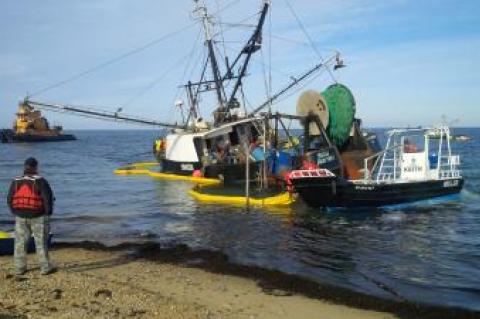 The Miss Scarlett, which ran aground just off Navy Beach in Montauk on Nov. 17, was towed across Long Island Sound on Tuesday.