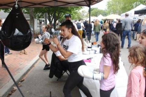 Newtown Lane in East Hampton was filled with visitors last year during a first-ever street fair. The fair will return on May 12.