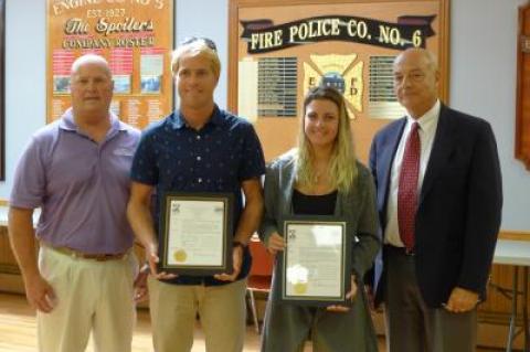 Those taking part in an ocean rescue at Georgica Beach in August were recognized at the East Hampton Village Board's work session on Thursday. From left, Francis Mott, East Hampton Village's beach manager; Ethan Dayton, a former lifeguard; Dana Dragone, a lifeguard, and Richard Lawler of the board took part in a ceremony in which Mr. Lawler read a proclamation recognizing the quick action of five rescuers.