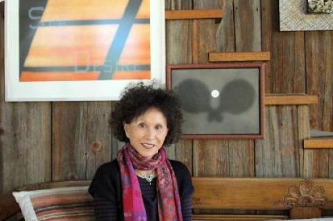 Lana Jokel sat recently in her Bridgehampton house beneath two works by Ed Ruscha.