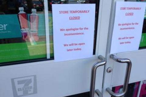 A sign on the door of the Sag Harbor 7-Eleven Monday promised that it would reopen soon.