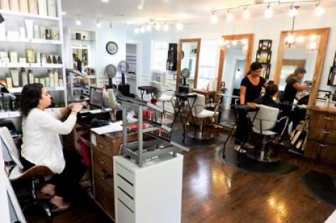 Annie Kim, the owner of the Scarlett Rose salon, hopes her business can remain in its Division Street location despite the sale of the property.