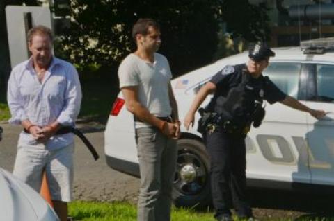 Chris W. Layton, left, and Sahm Adrangi, center, appeared in East Hampton Town Justice Court on Saturday following their drunken driving arrests.