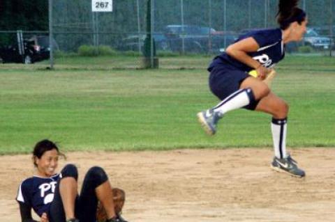 Theresa Schirrippa, P.B.A.’s third baseman, vaulted over the team’s usually flawless shortstop, Mylan Le, to keep a Groundworks bouncer in the infield during Aug. 7’s game.