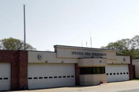 The 150-foot communications antenna erected behind the Springs Firehouse surprised neighbors and prompted a rash of complaints about its safety and aesthetics.