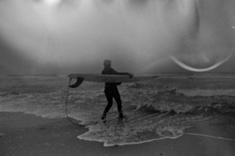 Lisa Spellman, about to set off in Montauk during Saturday’s snowstorm, finds surfing to be “an amazing equalizer.”