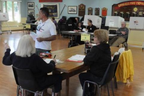 Voters cast presidential primary ballots at the Springs Firehouse on Tuesday. Here in the First Congressional District, Republicans supported Donald Trump by a wider margin than elsewhere in the state; while Hillary Clinton's victory in the Democratic contest was narrower than elsewhere in New York.