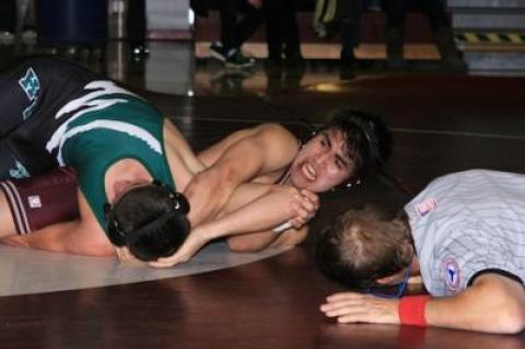 Mike Peralta, on top above, won a major 13-2 decision over his 145-pound Harborfields opponent, and won by pin at Eastport-South Manor Friday.