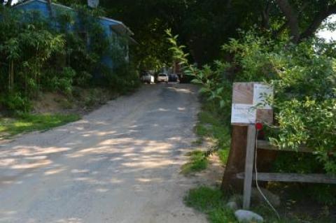 A photo taken in August, shows the building permit for work at 11 Ditch Plains Road posted at the driveway to the property.