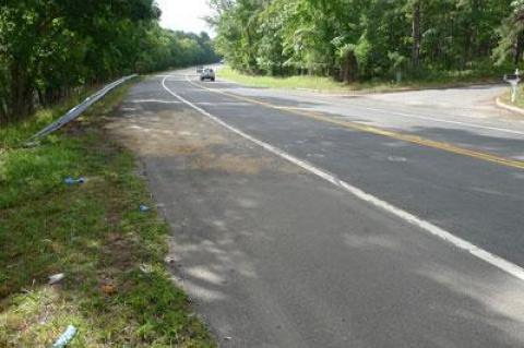 Debris and emergency medical supplies remained at the site of Sunday's fatal, two-vehicle accident on Route 114 in East Hampton