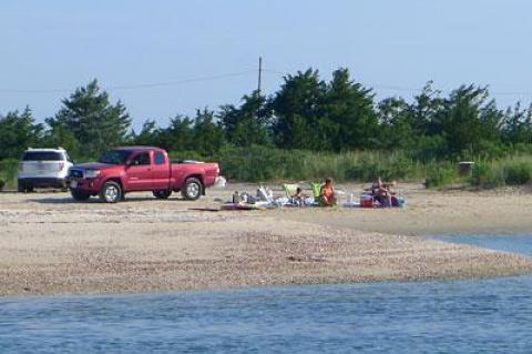 Some residents have objected to vehicles parking on the sand along the Three Mile Harbor shore at Maidstone Park and have asked the East Hampton Town Trustees to impose a ban.