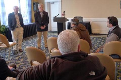 Suffolk Executive Steve Bellone, center, and County Legislator Jay Schneiderman spoke with a group of Montauk residents and business owners on Wednesday during a daylong visit to the East End.