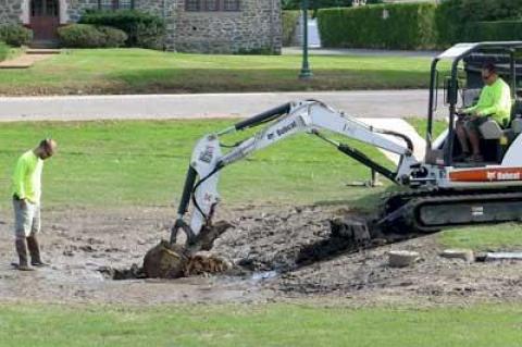 A water pollution-trapping project on the Village Green in East Hampton is being modified after it was found to have been improperly designed for the soil condition there.