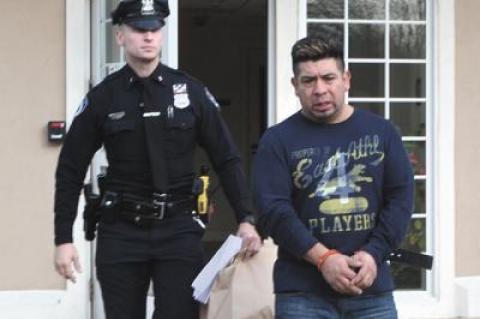 Gerson Mancilla, shown here being led away from East Hampton Town Justice Court on Sunday after being arraigned on a felony driving while intoxicated charge, was able to obtain a taxi driver’s license from the town earlier this year, despite a previous felony conviction.