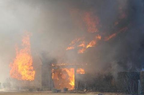 High winds quickly dashed any hope of saving an oceanfront house that caught fire and burned to the ground on Wednesday.