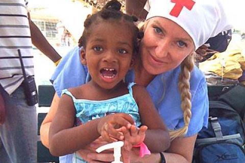 Alison Thompson with a Haitian orphan. Ms. Thompson will speak in Sag Harbor on July 15 about her experiences as a volunteer following several international disasters.