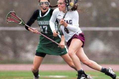 Maggie Pizzo, at right, who was the only one to do much of anything in the first half of Friday’s girls lacrosse game here with Harborfields, finished with 5 goals and 2 assists in the 15-9 loss.