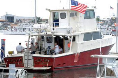 A 64-year-old diver died aboard the John Jack Thursday while on a trip to explore a World War II-era shipwreck.