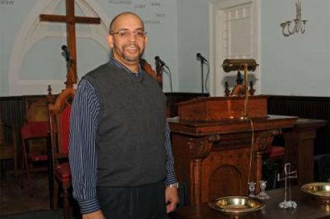 The Rev. Michael Jackson leads the Triune Baptist Church, which recently took up temporary quarters for services in a historic Sag Harbor church.