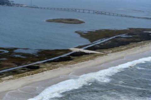 Sand washed over Dune Road in Westhampton from the high tide caused by Hurricane Sandy the night before.