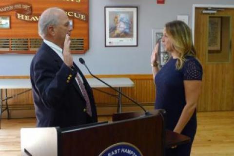 Rebecca Molinaro, the village clerk, swore in Arthur Graham to the East Hampton Village Board, on Wednesday.