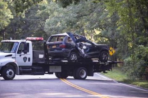 The Land Rover that crashed into the woods in Springs on Wednesday morning was taken away by a tow truck and impounded.