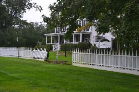 A New York City medallion taxi crashed through a fence at the Hedges Inn in East Hampton. The driver has been charged with drunken driving.