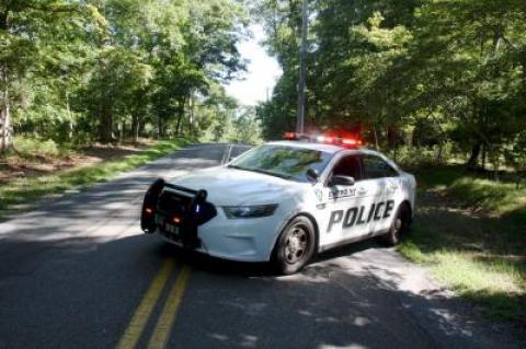 An East Hampton Town police car kept part of Northwest Road shut down to traffic on Sunday morning as police investigated an accident.