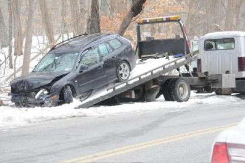 East Hampton Town police had a car that crashed into the woods pulled out after the driver was taken to Southampton Hospital.