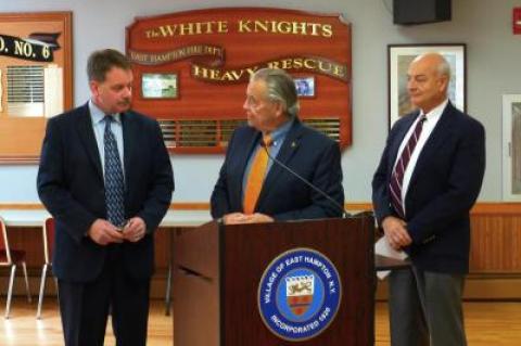 Mayor Paul F. Rickebach Jr., center, and Richard Lawler, right, an East Hampton Village Board member, thanked Jerry Larsen for his service to the village as he prepared to leave his post in January.