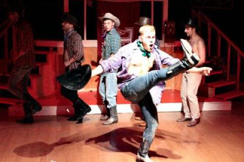 Adam Fronc leads a country and western number in a production of “The Best Little Whorehouse in Texas” at the Southampton Culture Center.