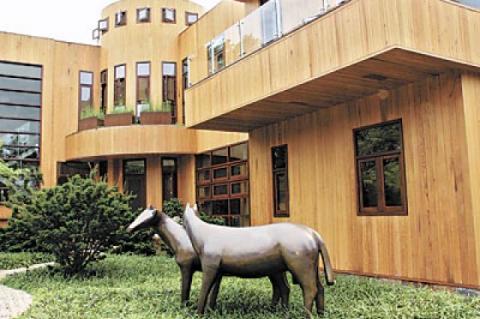 A sculpture of horses by Robert L. Hooke, an artist who lives in Sag Harbor, welcomes visitors to Susan Goldstein’s North Haven house. Her  daughter is a professional equestrian.